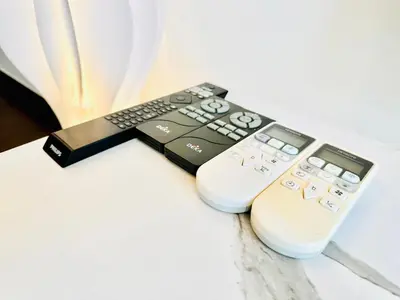 two remote controls sitting next to each other on a table at V Residence Suites-3A in Kuala Lumpur