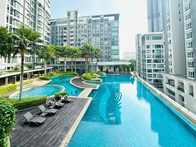 an overhead view of a pool with chairs and buildings at V Residence Suites-3A in Kuala Lumpur