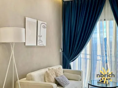 a living room with a couch and a window at Cozy Retreat in the heart of KL by nbrichstay in Kuala Lumpur