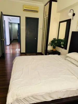 a bedroom with a large white bed in a room at Luxury Room Minutes from KLCC in Kuala Lumpur