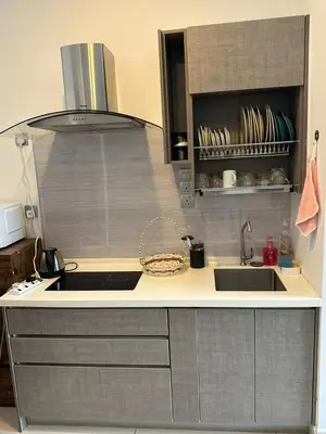 a kitchen with a sink and a counter top at Tamu Hotel & Suites Stay in Kuala Lumpur