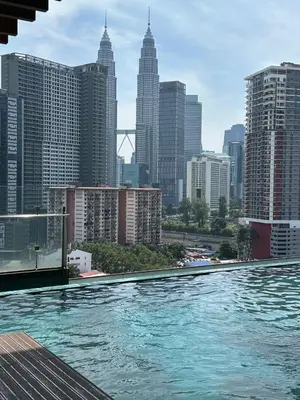 a swimming pool with a view of a city at Tamu Hotel & Suites Stay in Kuala Lumpur