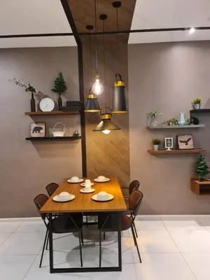 a dining room with a wooden table and chairs at The Robertson Residence Kuala Lumpur in Kuala Lumpur