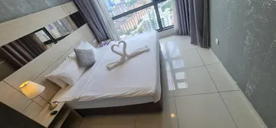 a bedroom with a bed with a heart decoration on it at The Robertson Residence Kuala Lumpur in Kuala Lumpur