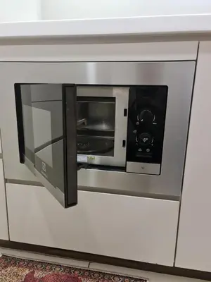 a microwave oven on a wall in a room at The Robertson Residence Kuala Lumpur in Kuala Lumpur
