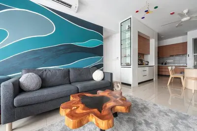 a living room with a couch and a table at M Vertica Kuala Lumpur by HLG Re in Kuala Lumpur