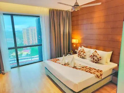a bedroom with a bed and a large window at Lila Suites D, Majestic Place in Kuala Lumpur