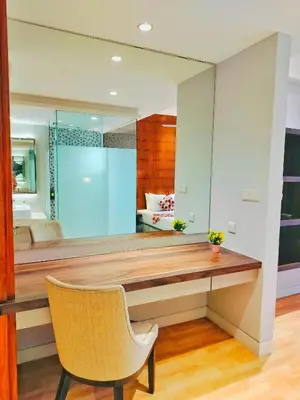 a room with a desk and a chair and a bedroom at Lila Suites D, Majestic Place in Kuala Lumpur