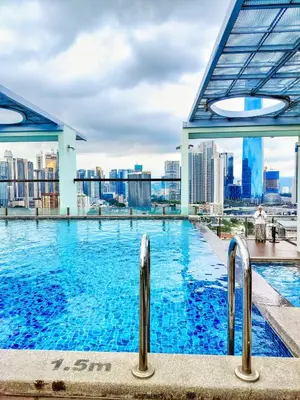 a swimming pool with a city skyline in the background at Lila Suites D, Majestic Place in Kuala Lumpur