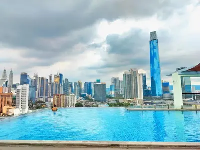 a swimming pool with a city skyline in the background at Lila Suites D, Majestic Place in Kuala Lumpur