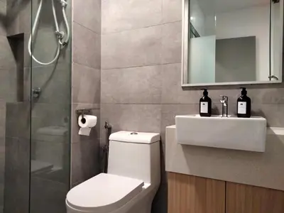 a bathroom with a toilet and a sink and a shower at Riveria Suites, KL Sentral by Homebrickz in Kuala Lumpur