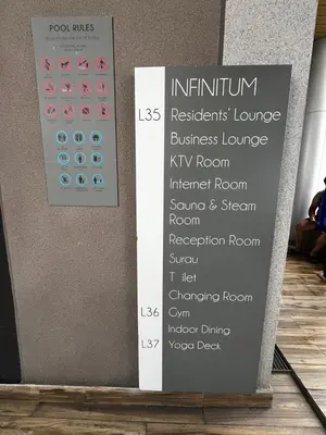 a sign on the side of a wall with names at THE COLONY INFINITUM Sweet Home SR in Kuala Lumpur