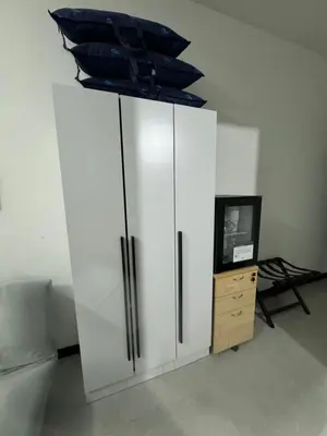 a white cabinet with a tv on top of it at KL City Nue Suites Entire Condo 2R2B 3 plus 1 guests in Kuala Lumpur