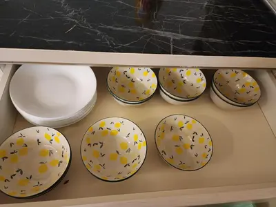 a drawer filled with bowls and plates on a shelf at 4R2B crest residences walk to klcc jln alor train 2station to bukitbintang water machine in Kuala Lumpur