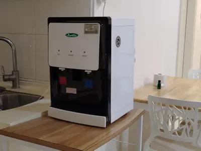 a refrigerator sitting on top of a kitchen counter at 4R2B crest residences walk to klcc jln alor train 2station to bukitbintang water machine in Kuala Lumpur