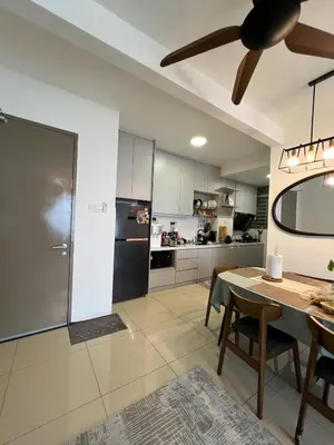 a large kitchen with a table and a ceiling fan at Casa Dbandar in Kuala Lumpur