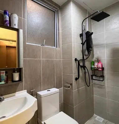 a bathroom with a shower and a toilet and a sink at Casa Dbandar in Kuala Lumpur