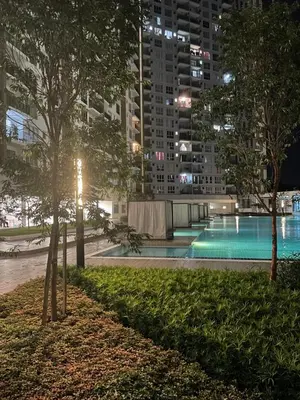 a swimming pool at night in a city at Casa Dbandar in Kuala Lumpur