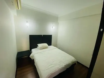a small room with a white bed in it at Luxury Room At Bukit Bintang in Kuala Lumpur