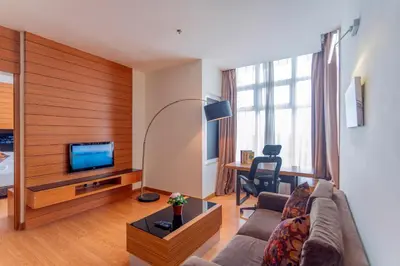 a living room with a couch and a tv at Dua Sentral 2km to KL Sentral in Kuala Lumpur