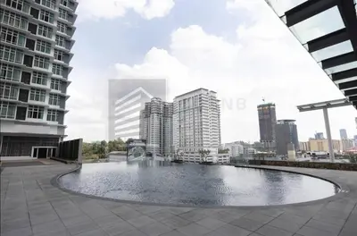 a pool in the middle of a city with tall buildings at Dua Sentral 2km to KL Sentral in Kuala Lumpur