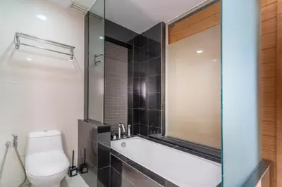 a bathroom with a bath tub and a toilet at Dua Sentral 2km to KL Sentral in Kuala Lumpur