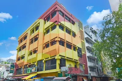 a multicolored building on the side of a street at Hotel O Pollodium Chinatown in Kuala Lumpur