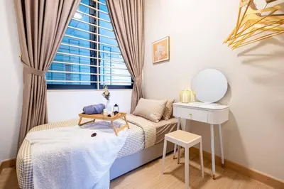 a small bedroom with a bed and a mirror at KidsVille Shamelin Star KLCC View Infinity Pool in Kuala Lumpur
