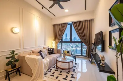 a living room with a couch and a large window at KidsVille Shamelin Star KLCC View Infinity Pool in Kuala Lumpur