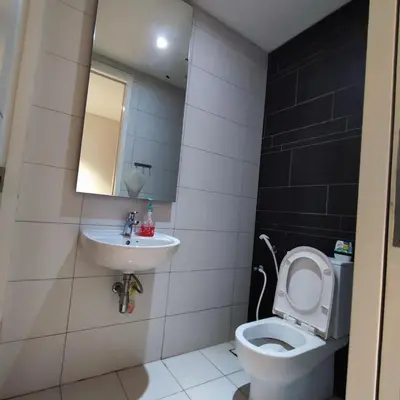 a bathroom with a toilet and a sink at Anggun residence studio klcc in Kuala Lumpur