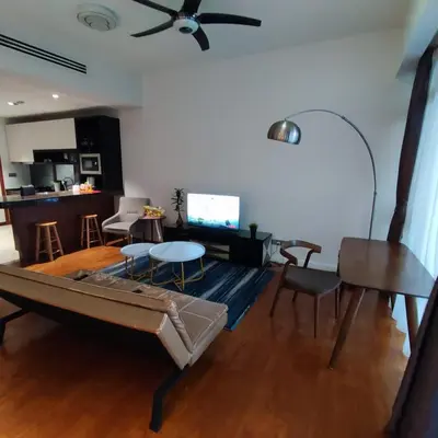 a living room with a couch and a table at Anggun residence studio klcc in Kuala Lumpur