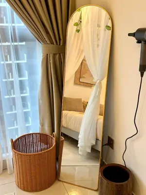 a mirror in the corner of a room with a bed at The Little Bali - Karaoke - 4 Pax in Kuala Lumpur
