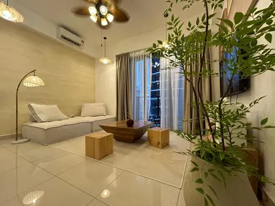 a living room with a couch and a table at The Little Bali - Karaoke - 4 Pax in Kuala Lumpur