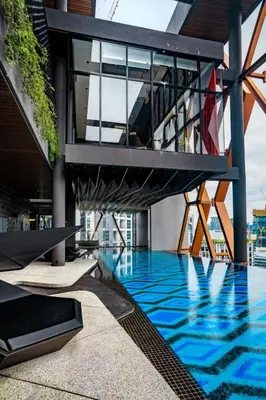 a view of a building with a swimming pool at Scarletz Suites KLCC by Minshuku in Kuala Lumpur