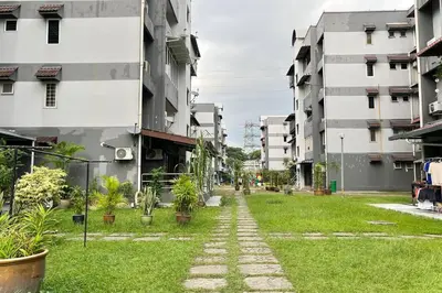a walkway in the middle of a city with buildings at 3BR Family Stay at Desa Pandan KL ready Wifi Netflix in Kuala Lumpur