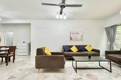 a living room with a couch and a table at 3BR Family Stay at Desa Pandan KL ready Wifi Netflix in Kuala Lumpur