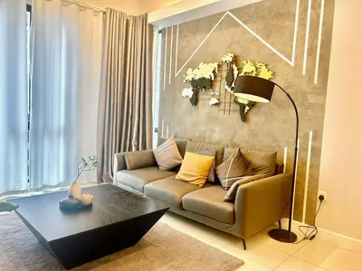 a living room with a couch and a table at KL Sentral 28th Floor CityCenter in Kuala Lumpur
