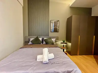 a bedroom with a bed with towels on it at KL Sentral 28th Floor CityCenter in Kuala Lumpur