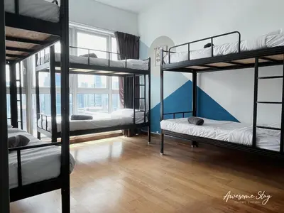 a room with four bunk beds and a window at Awesomestay Hostel near KLCC , walk to PWTC PUTRA in Kuala Lumpur