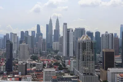 a city skyline with many tall buildings at Awesomestay Hostel near KLCC , walk to PWTC PUTRA in Kuala Lumpur