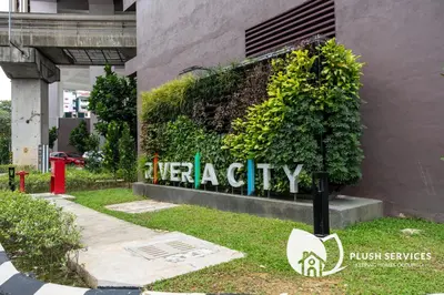 a sign in front of a building at Riveria City at KL Sentral by Plush in Kuala Lumpur