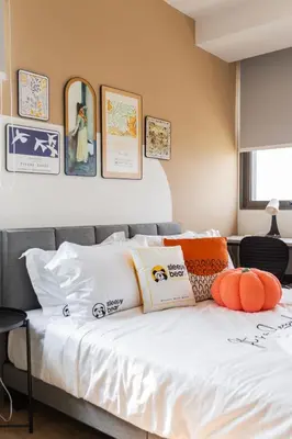 a bedroom with a bed with pillows on it at Riveria City KL Sentral by Sleepy Bear in Kuala Lumpur