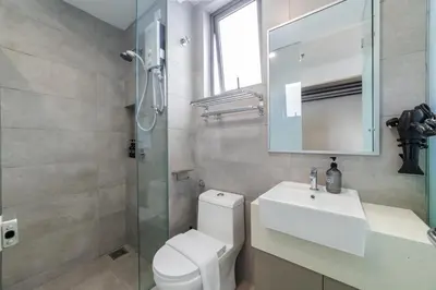 a bathroom with a toilet and a sink and a shower at Riveria City KL Sentral by Sleepy Bear in Kuala Lumpur