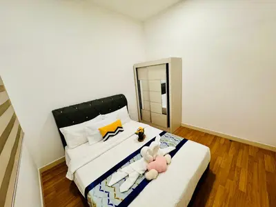 a bedroom with a bed with two stuffed animals on it at Velocity Residence linkway Sunway mall in Kuala Lumpur