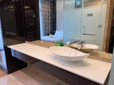 a bathroom counter with a sink and a mirror at Dorsett Bukit Bintang with Bathtub by Prestige in Kuala Lumpur