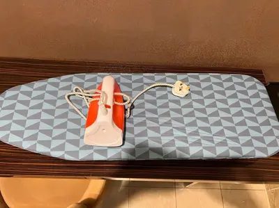 a purse sitting on top of a bench at Dorsett Bukit Bintang with Bathtub by Prestige in Kuala Lumpur
