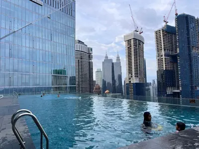 a group of people in a swimming pool on a building at Dorsett Bukit Bintang with Bathtub by Prestige in Kuala Lumpur