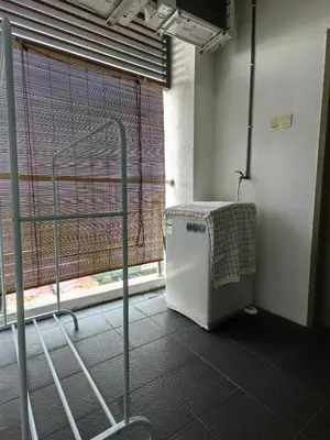 a room with a window with a washing machine at Setapak Central KL - Zetapark Spring Suites in Kuala Lumpur