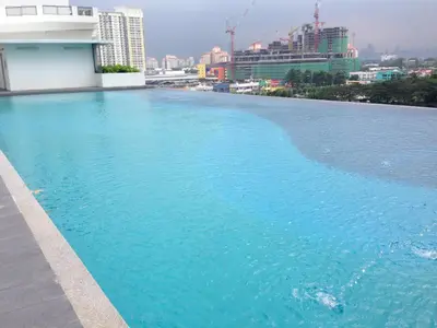 a large swimming pool on the roof of a building at Setapak Central KL - Zetapark Spring Suites in Kuala Lumpur