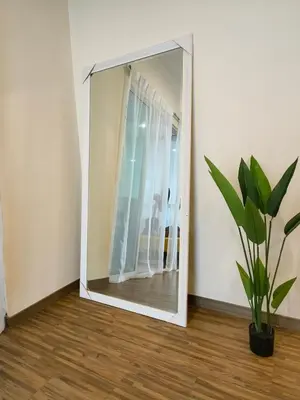 a mirror in a room with a potted plant at Setapak Central KL - Zetapark Spring Suites in Kuala Lumpur